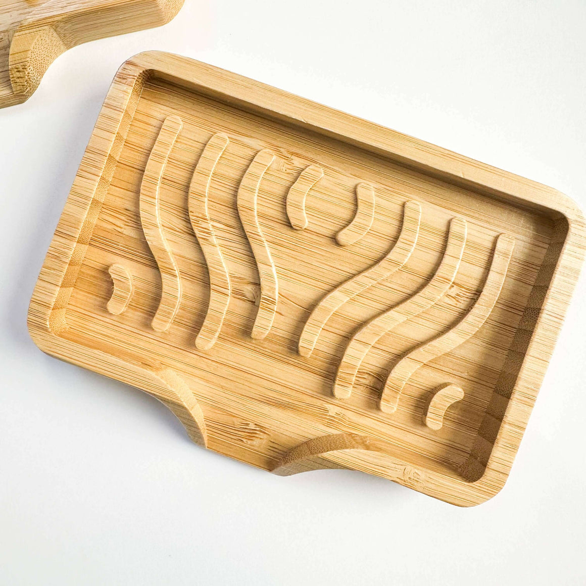 Wooden tray with coffee bean pattern on a white background
