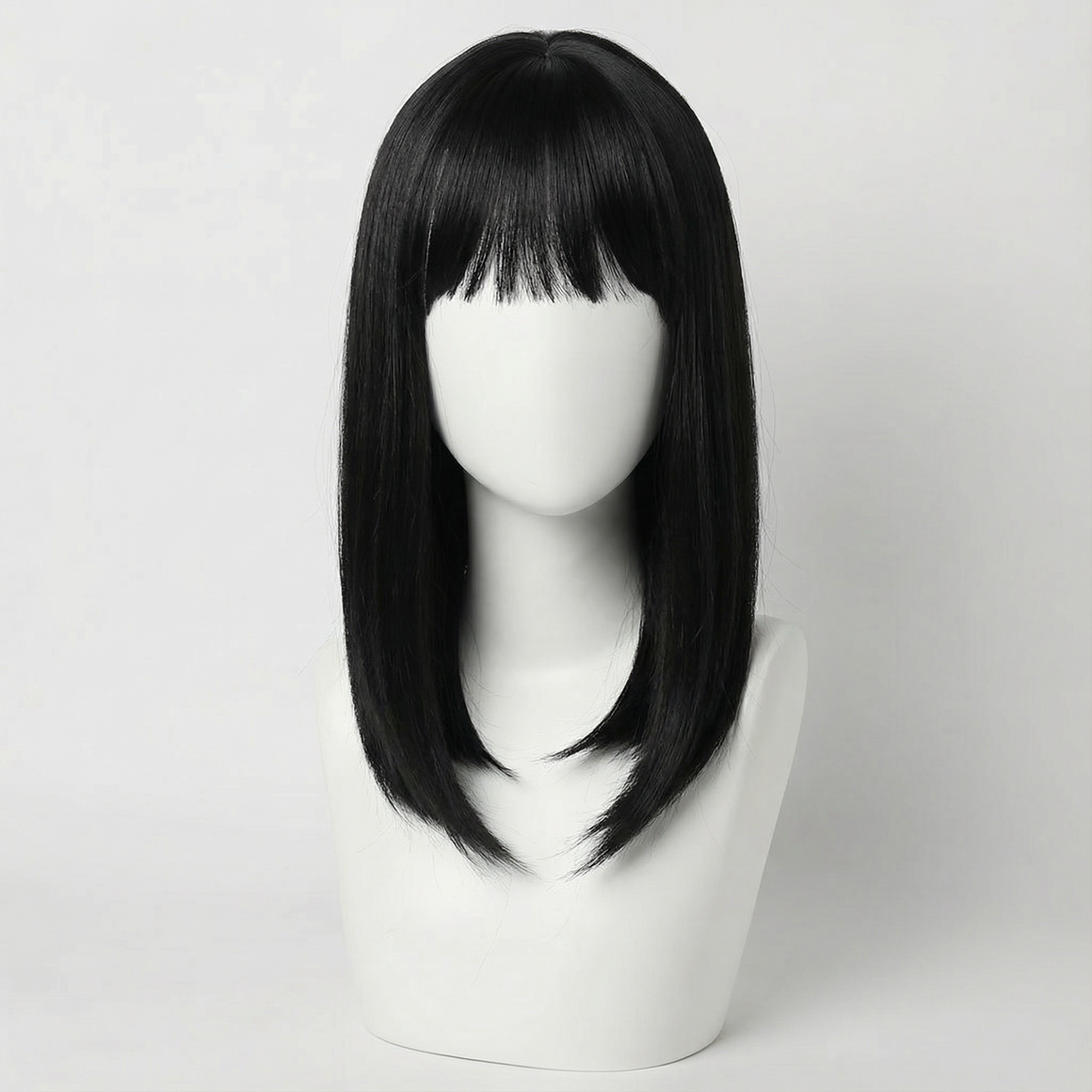 Cecil Short Black Wig with Bangs displayed on a wig stand, showcasing its sleek design and modern feathered bob.