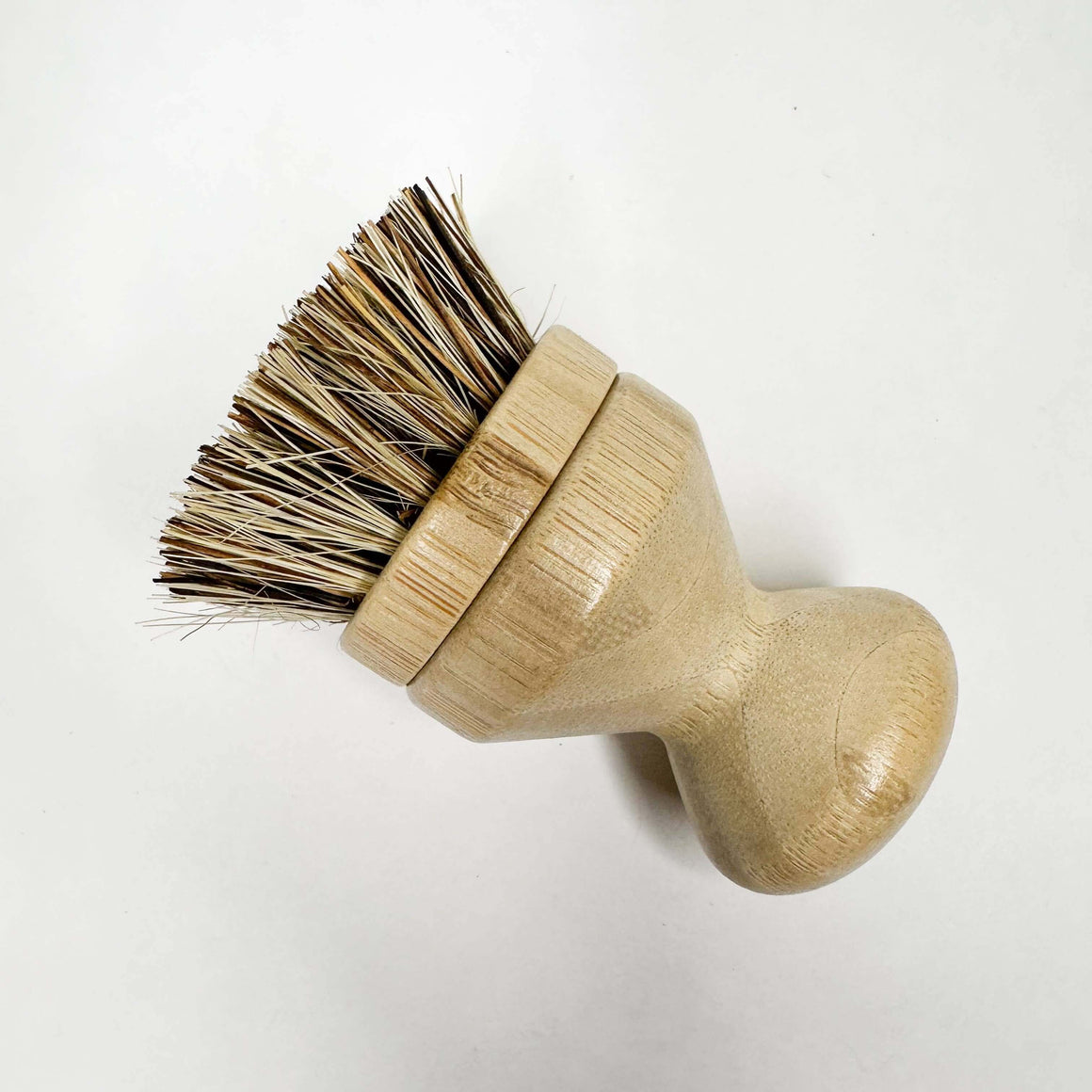 Wooden brush with bristle head on a white background