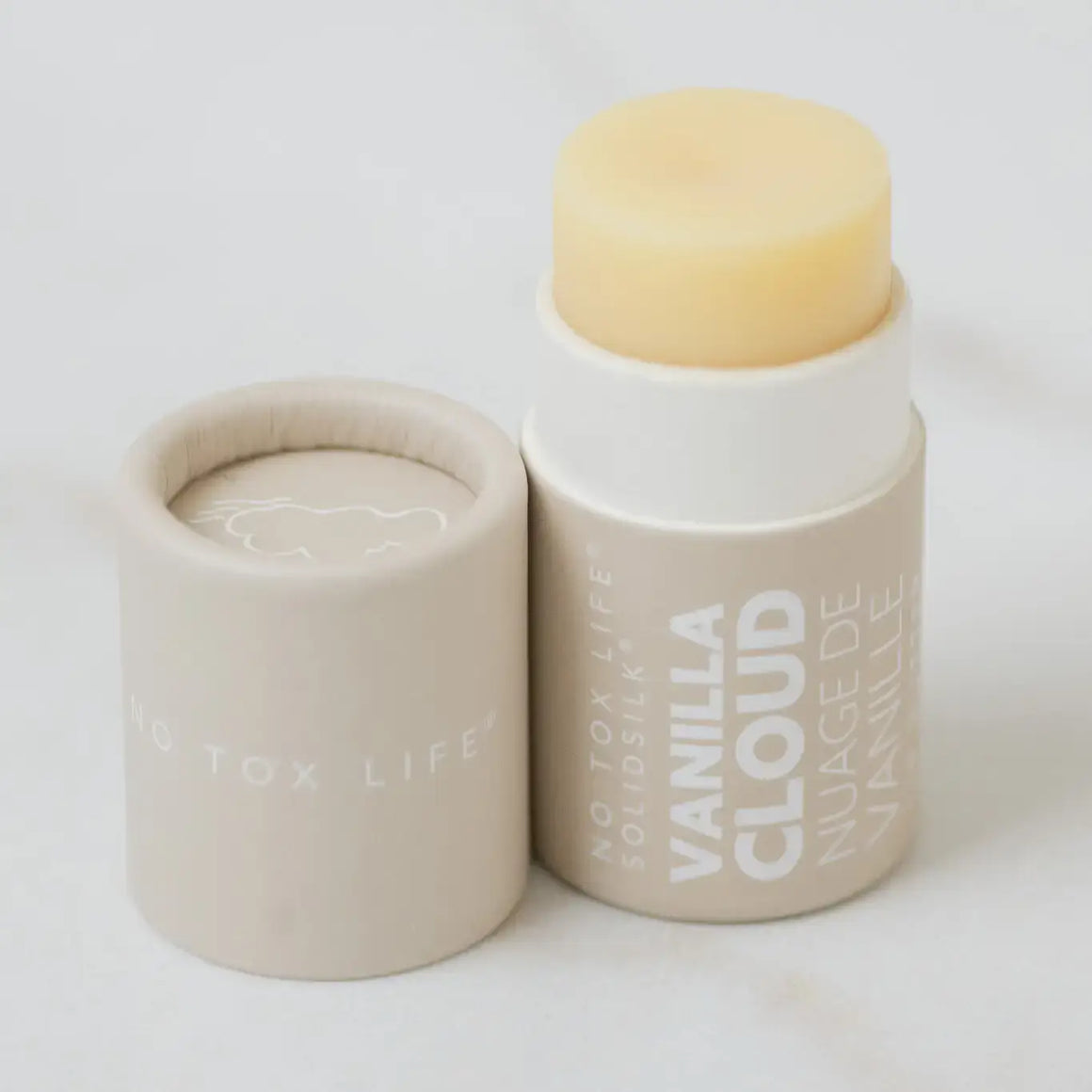 Vanilla cloud skincare product with beige container on a white background