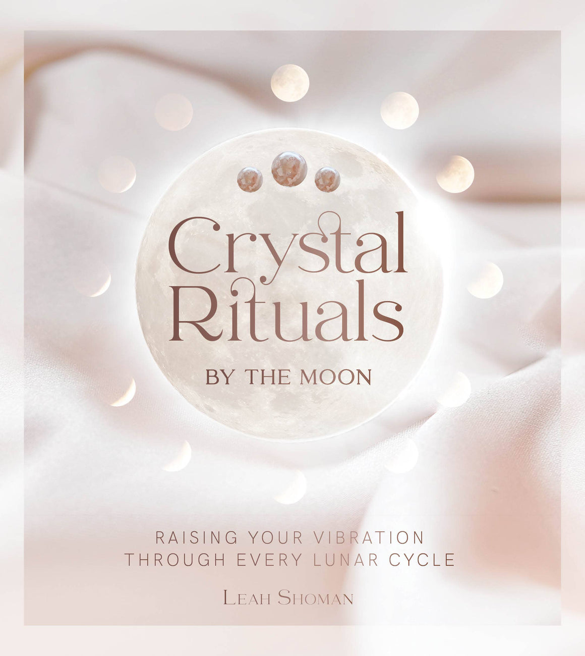 Book cover of 'Crystal Rituals by the Moon' with a moon design and soft background.