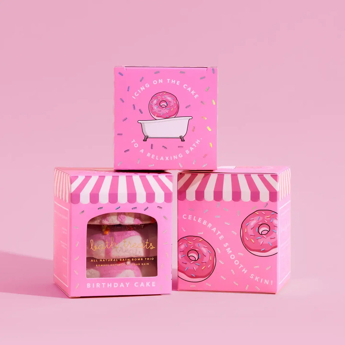 Colorful packaging for Birthday Cake Bath Bombs in a trio box, featuring donut illustrations and a relaxing bath theme.
