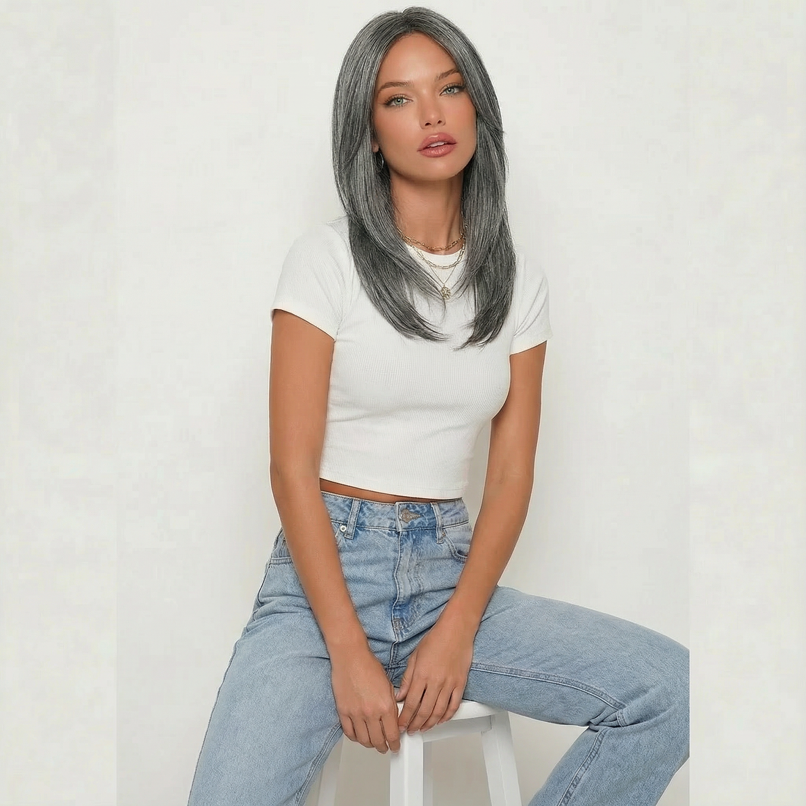 Dixie Dark Grey Layered Wig worn by a model, featuring cool-toned ash grey color and shoulder-length layers.