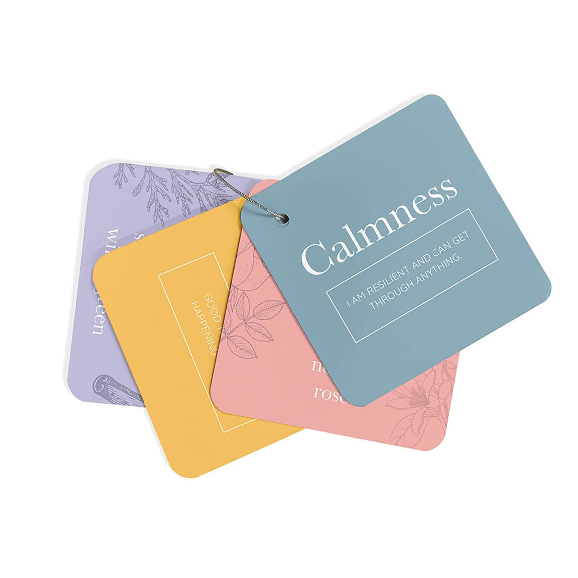 Box of essential oils cards with colorful cards on a white background