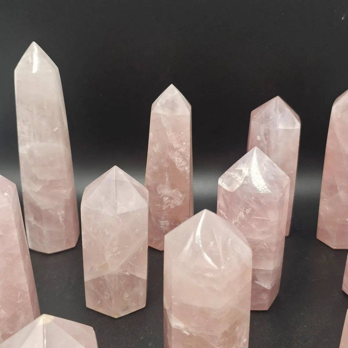 Set of pink crystal towers on a black background