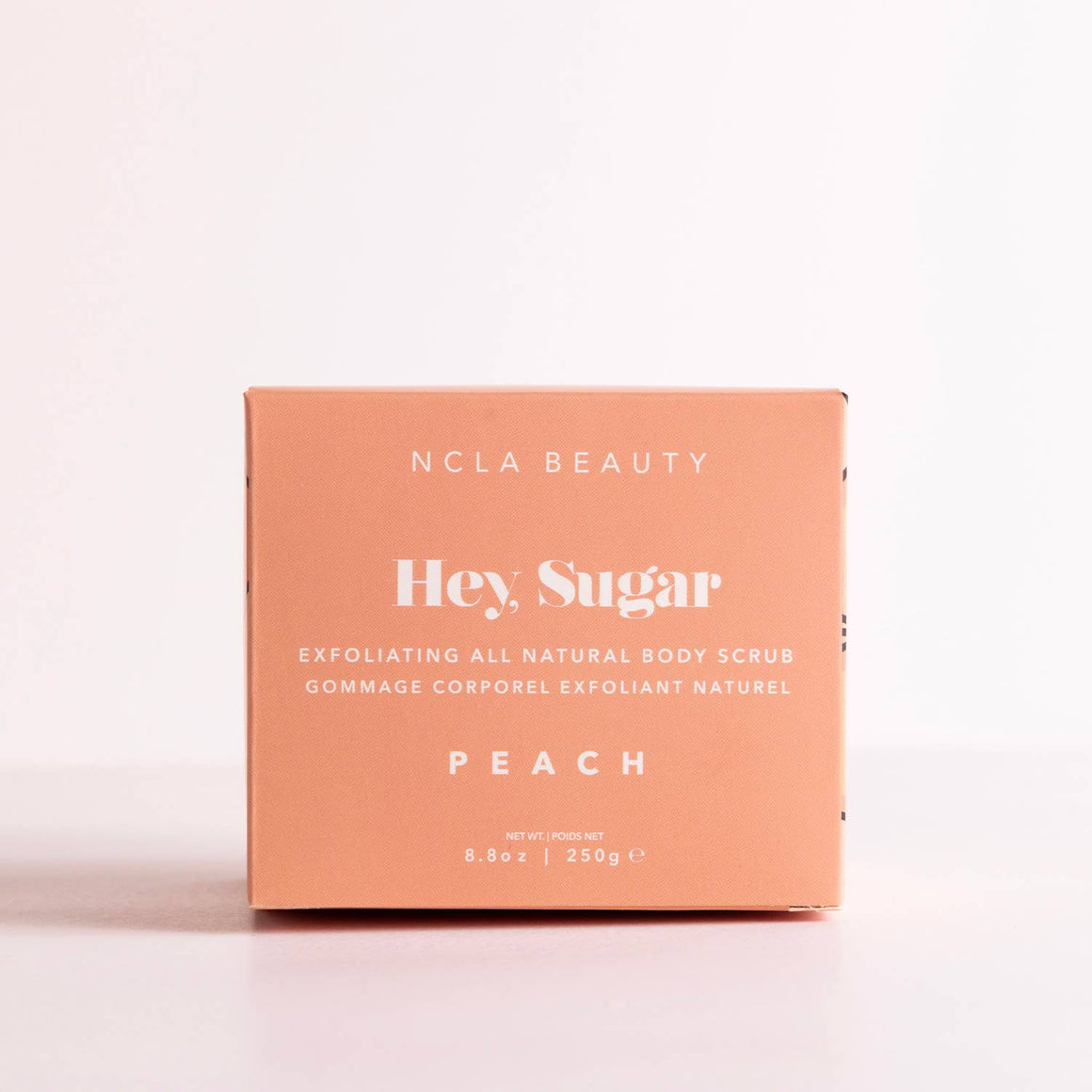 NCLA Beauty Hey Sugar Peach exfoliating body scrub packaging on a white background