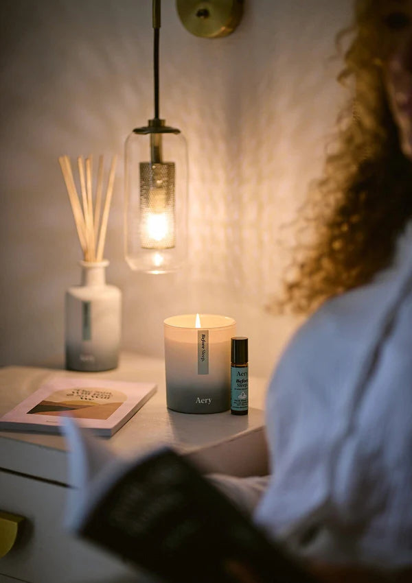 Aery Living - BEFORE SLEEP SCENTED CANDLE - LAVENDER EUCALYPTUS AND CEDAR lit with person reading