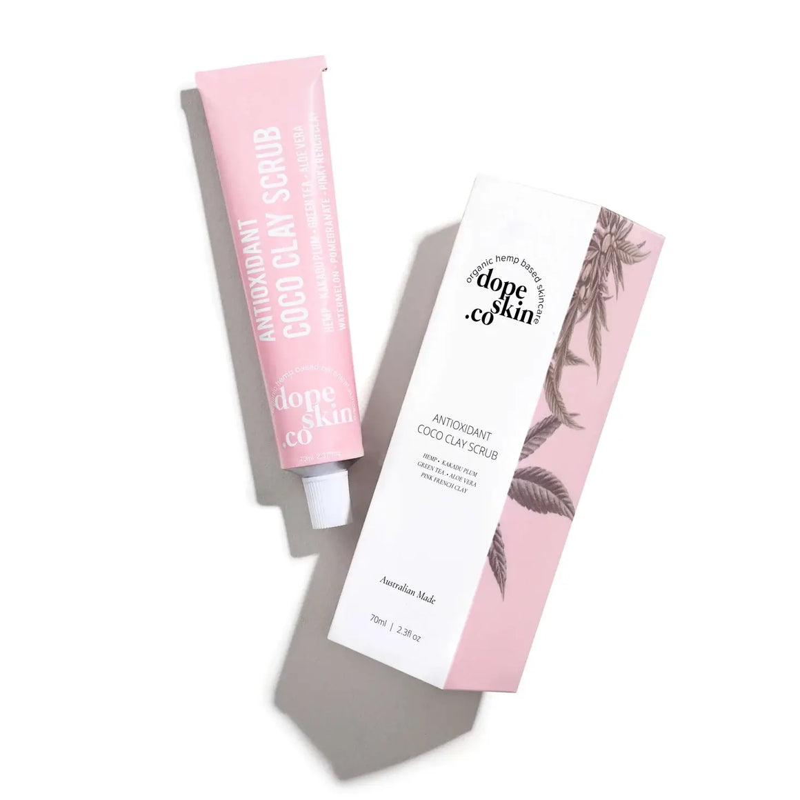 Two tubes of Dope Skin Co. Antioxidant Coco Clay Scrub on a white background