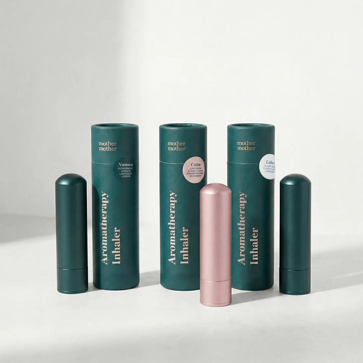 Collection of Aromatherapy Inhalers with green and pink designs on a white background