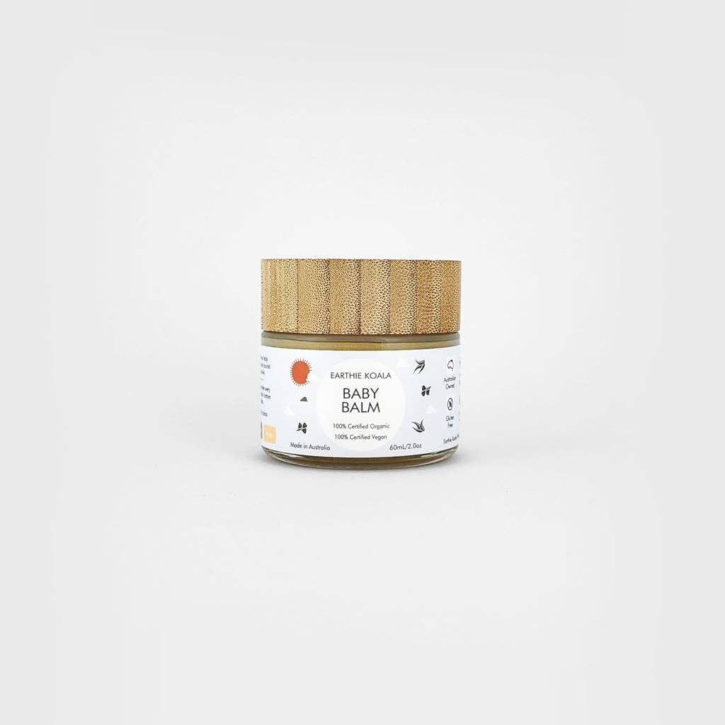 Baby Balm with Lavender and Orange Oil 60ml - Earthie Koala in a jar with a wooden lid on a gray background.