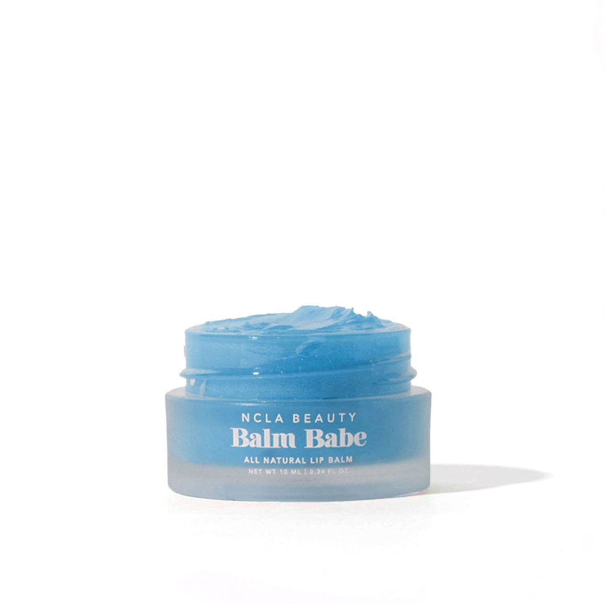 Blue lip balm jar labeled 'Balm Babe' by NCLA Beauty on a white background