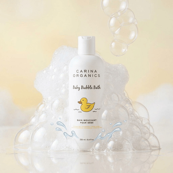 Carina Organics baby bubble bath bottle with bubbles on a light yellow background