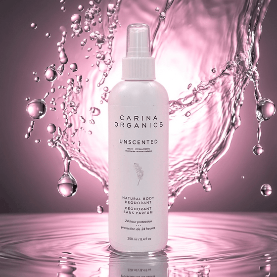 Carina Organics unscented deodorant bottle with water droplets on a pink background