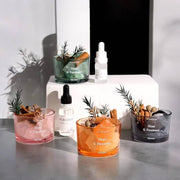 Crystal Aroma Home Scent Stone Diffuser collection with decorative candles and oil bottles.