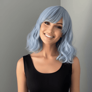 Faye Short Pastel Blue Body Wave Wig with Bangs, featuring soft waves and bangs, perfect for a whimsical hairstyle.
