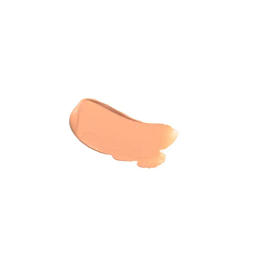 Patch of peach-colored makeup on a white background