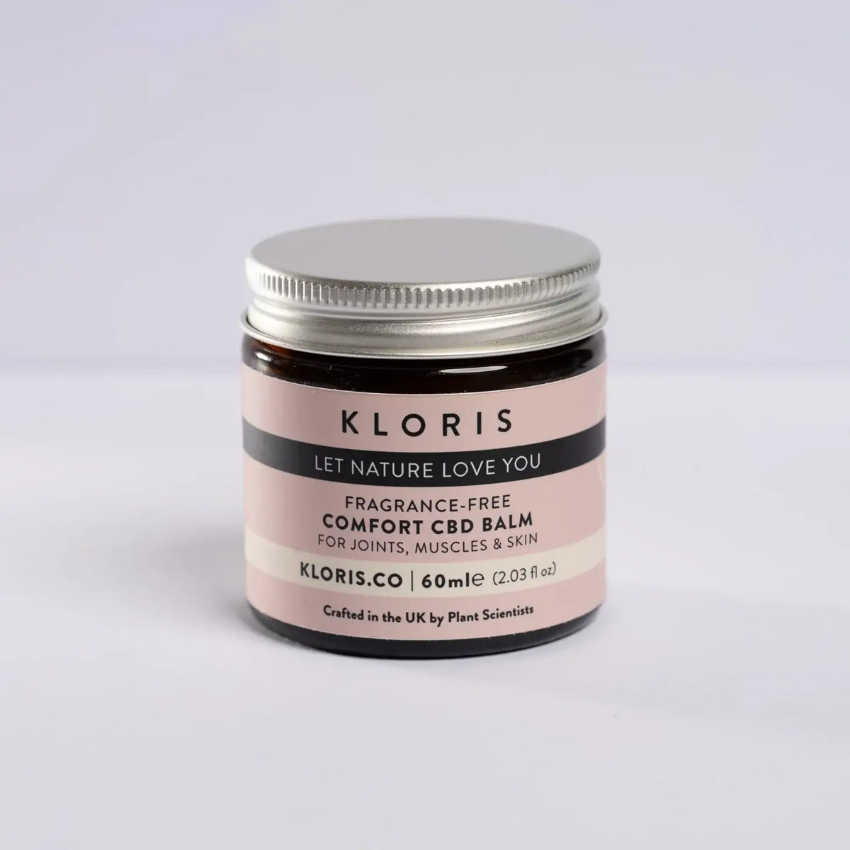 Jar of Kloris Comfort CBD Balm on a light gray background