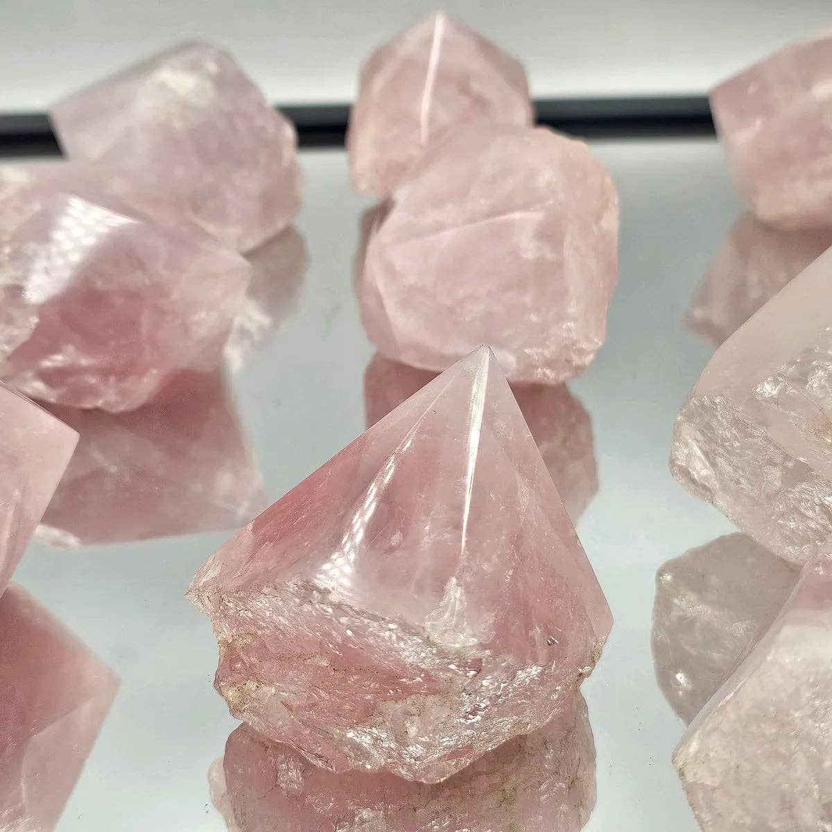 Close-up of pink crystal formations on a white background