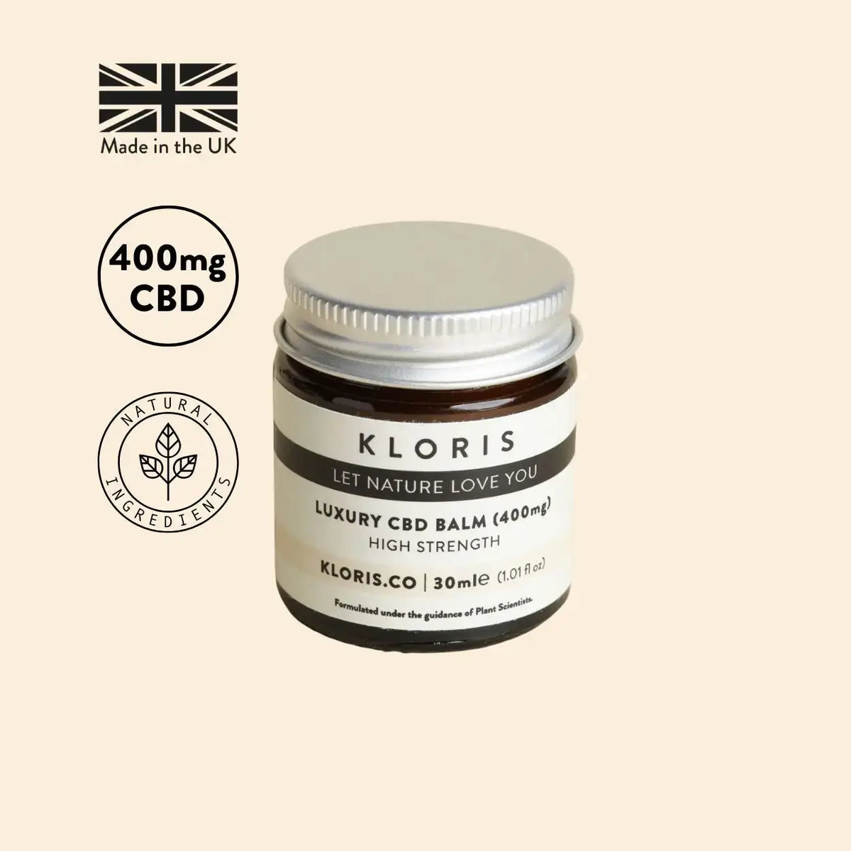Kloris CBD balm jar with branding and product details on a beige background