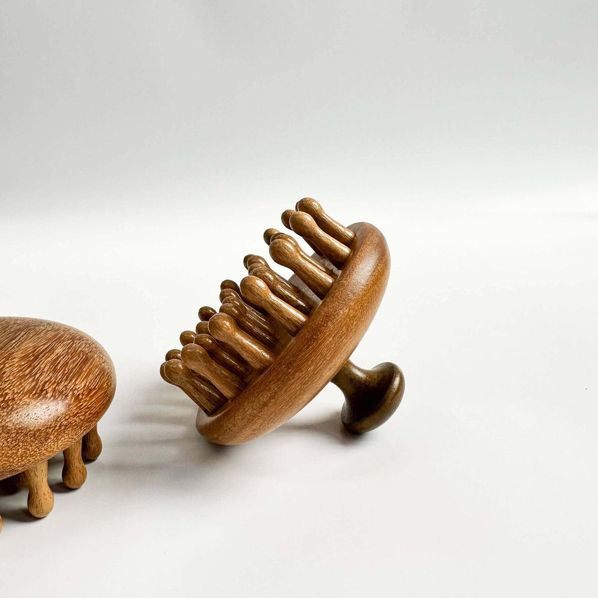 Wooden hairbrush on a white background