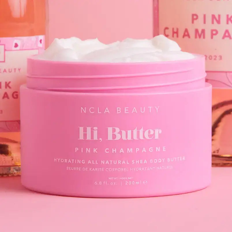 Hi, Butter All Natural Shea Body Butter in pink container with cream inside, perfect for hydration and skin nourishment.