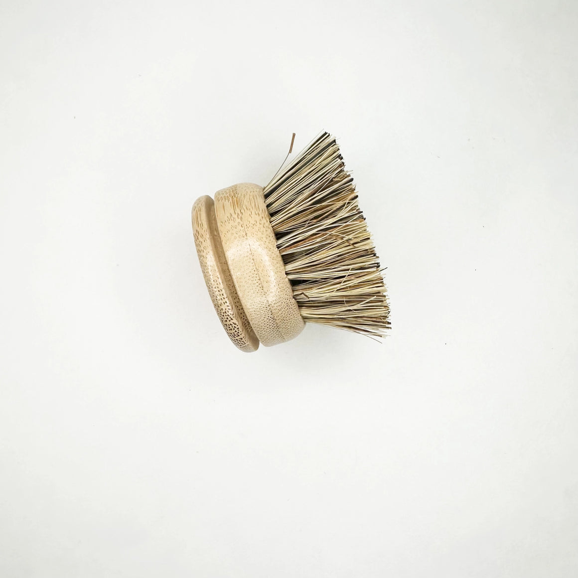 Wooden brush with bristle head on a white background