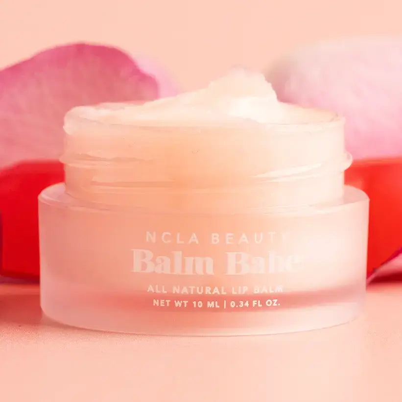 Balm Babe Candy Roses Lip Balm in a clear jar with rose petals, offering all-natural hydration and sweet candy roses scent.