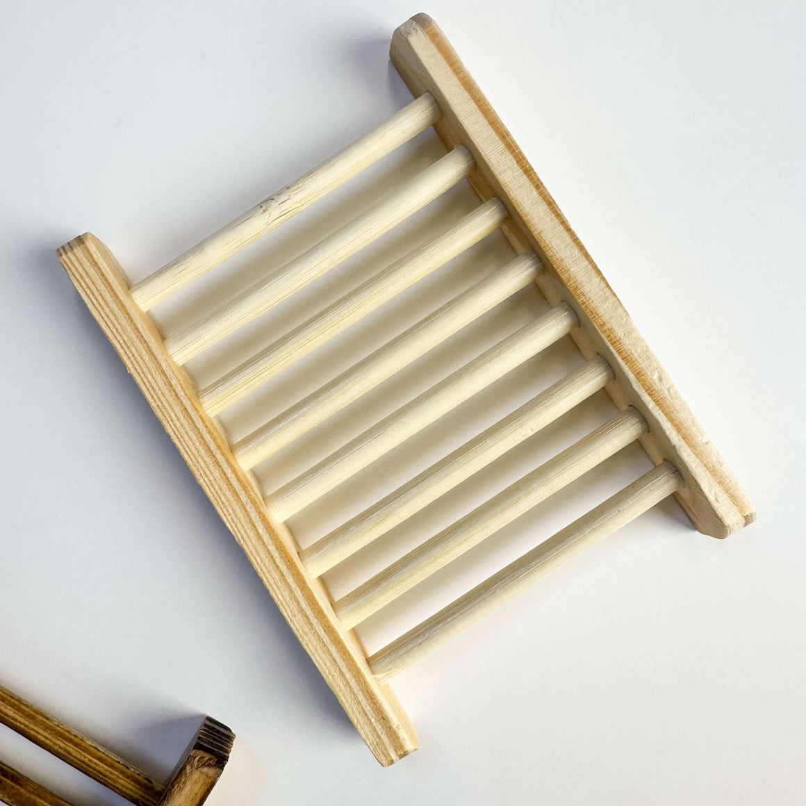 Wooden soap dish on a white background