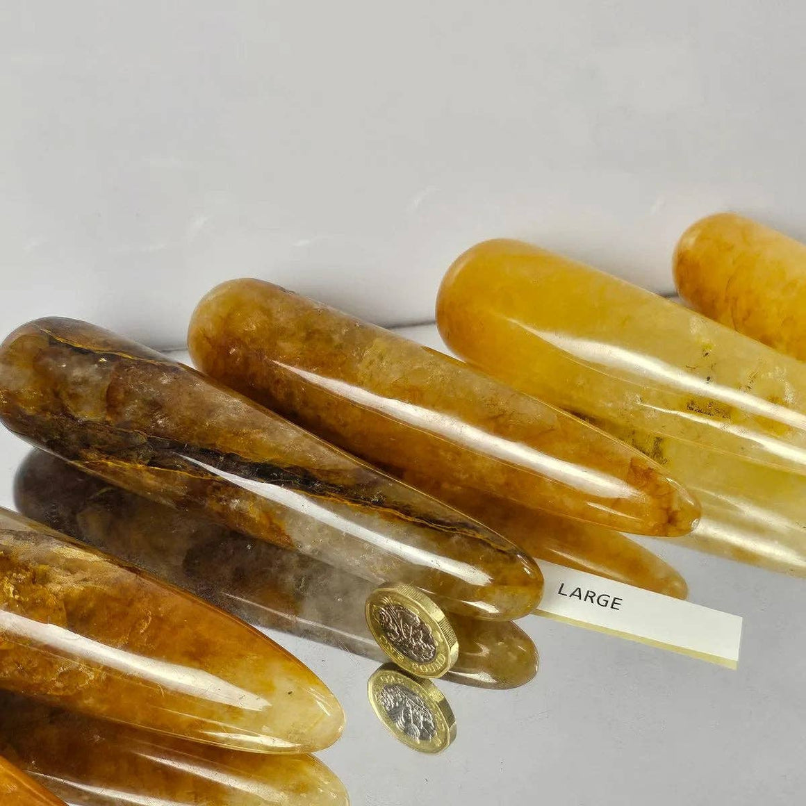 Set of amber-colored hair clips on a white background