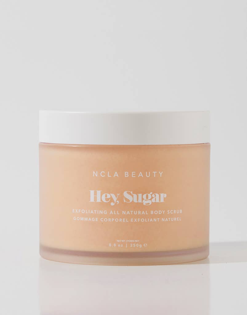 NCLA Beauty 'Hey Sugar' exfoliating all natural body scrub jar on a light gray background