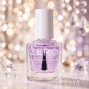 Purple nail polish bottle with white cap on a blurred festive background