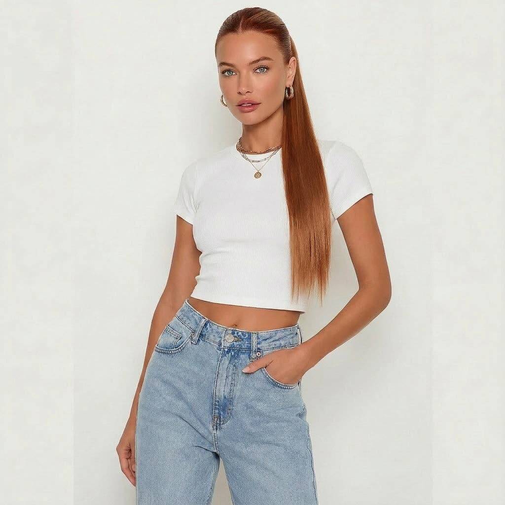 Model showcasing auburn silky straight ponytail extension with a stylish white crop top and denim jeans.