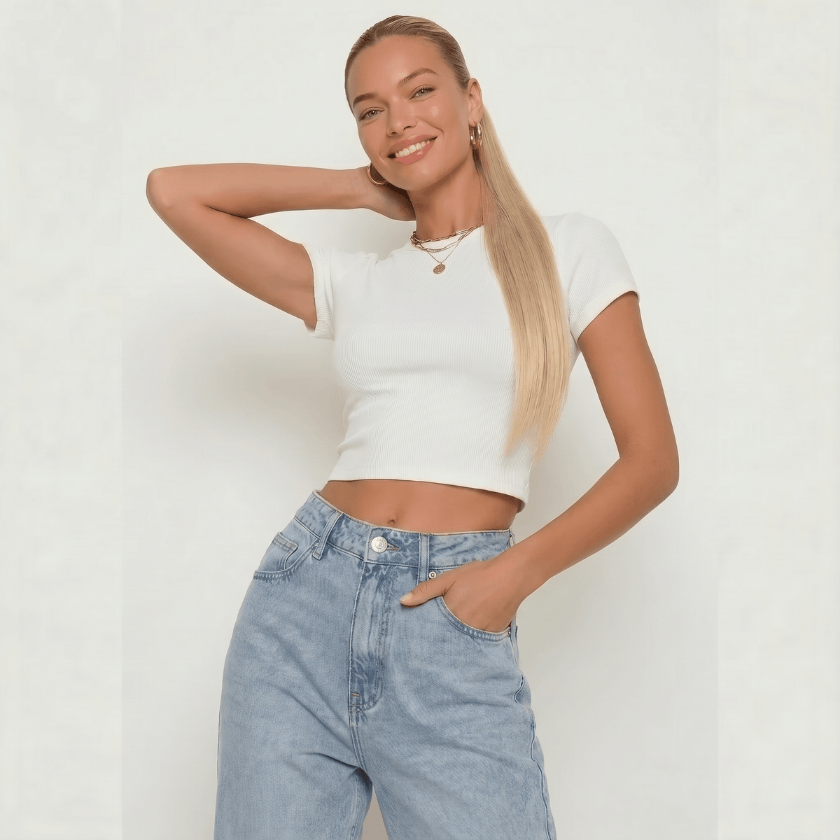 Model showcasing a stylish outfit with a silky straight buttery blonde ponytail hair extension.